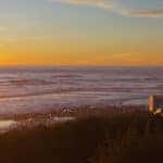 RVs on the beach at sunset