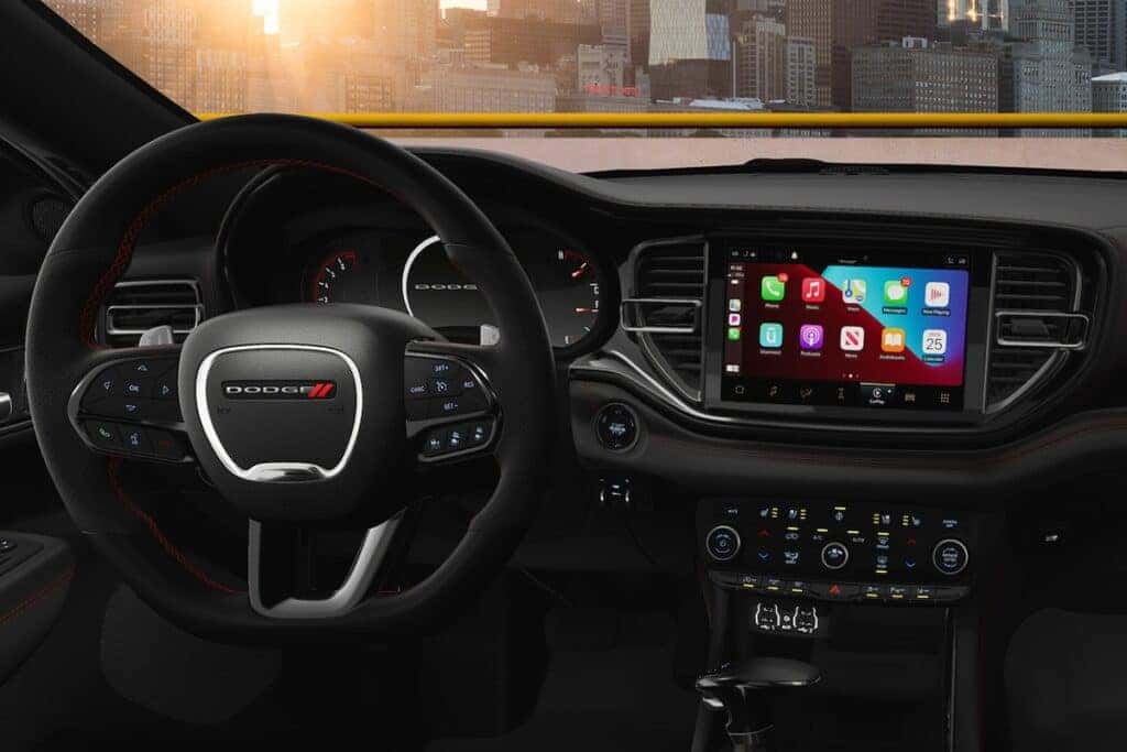 Modern 2025 Dodge Durango dashboard with touchscreen infotainment.