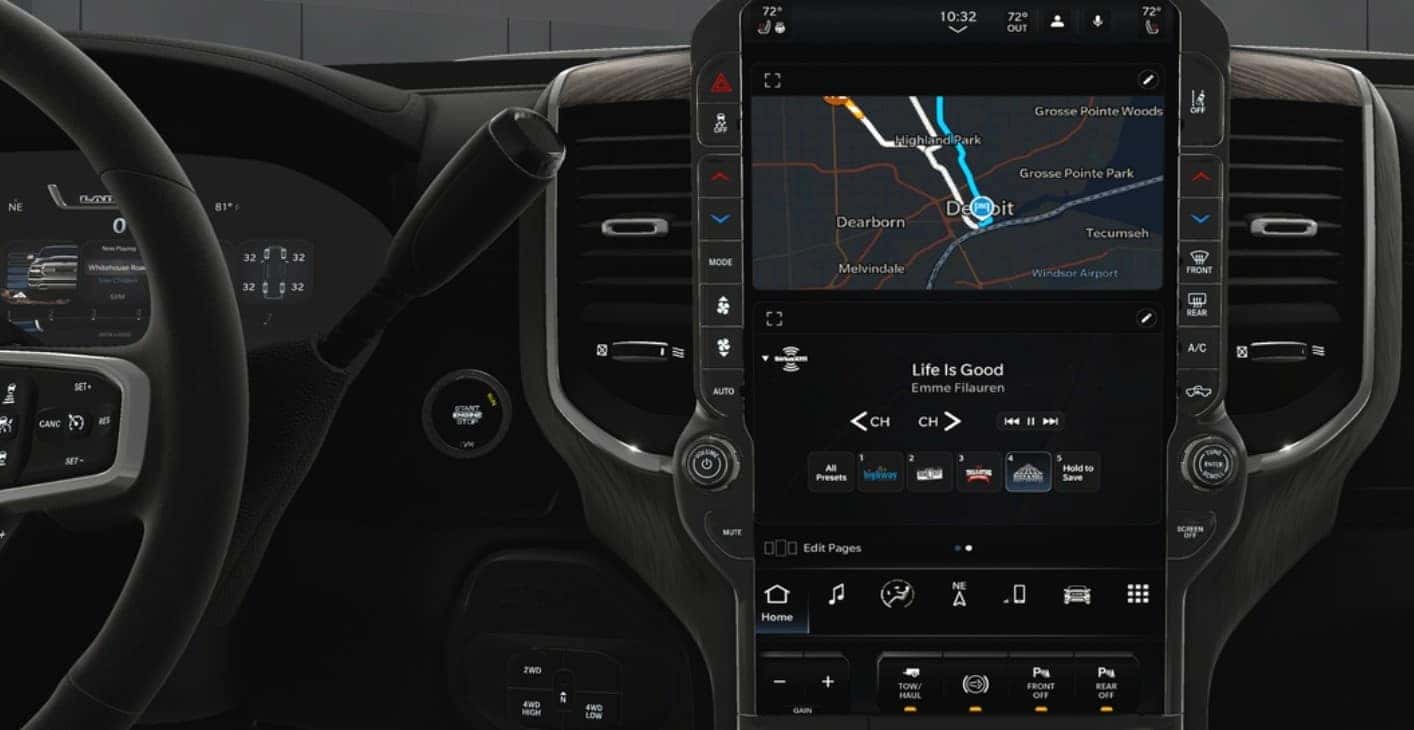 RAM 3500 interior featuring a large touchscreen with navigation, music controls, and climate settings, alongside a digital instrument cluster. Available at Bernard Northtown.