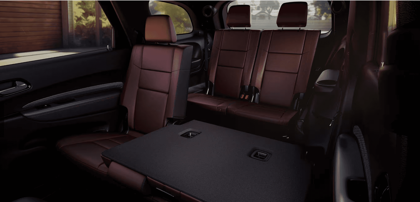 Rear interior view of the 2025 Durango showing folded third-row and second-row seats.