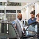 car dealer with customers