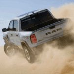 The 2026 RAM 1500 RHO off-roading in the sand