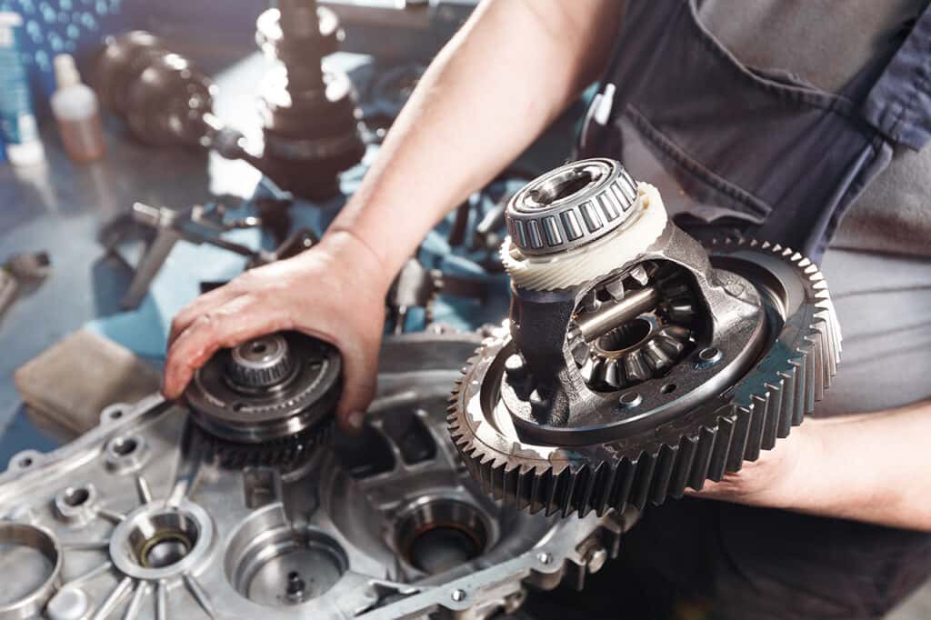 RAM service technician working on a transmission