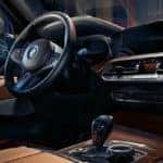 2019 bmw x5 interior with tan leather seating and wood trim