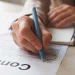 Person signing contract