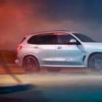 silver 2019 bmw x5 parked at gas station on foggy night
