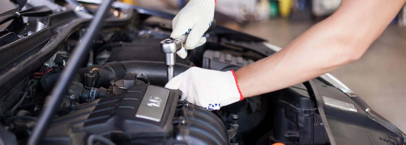 Mechanic Working on Engine