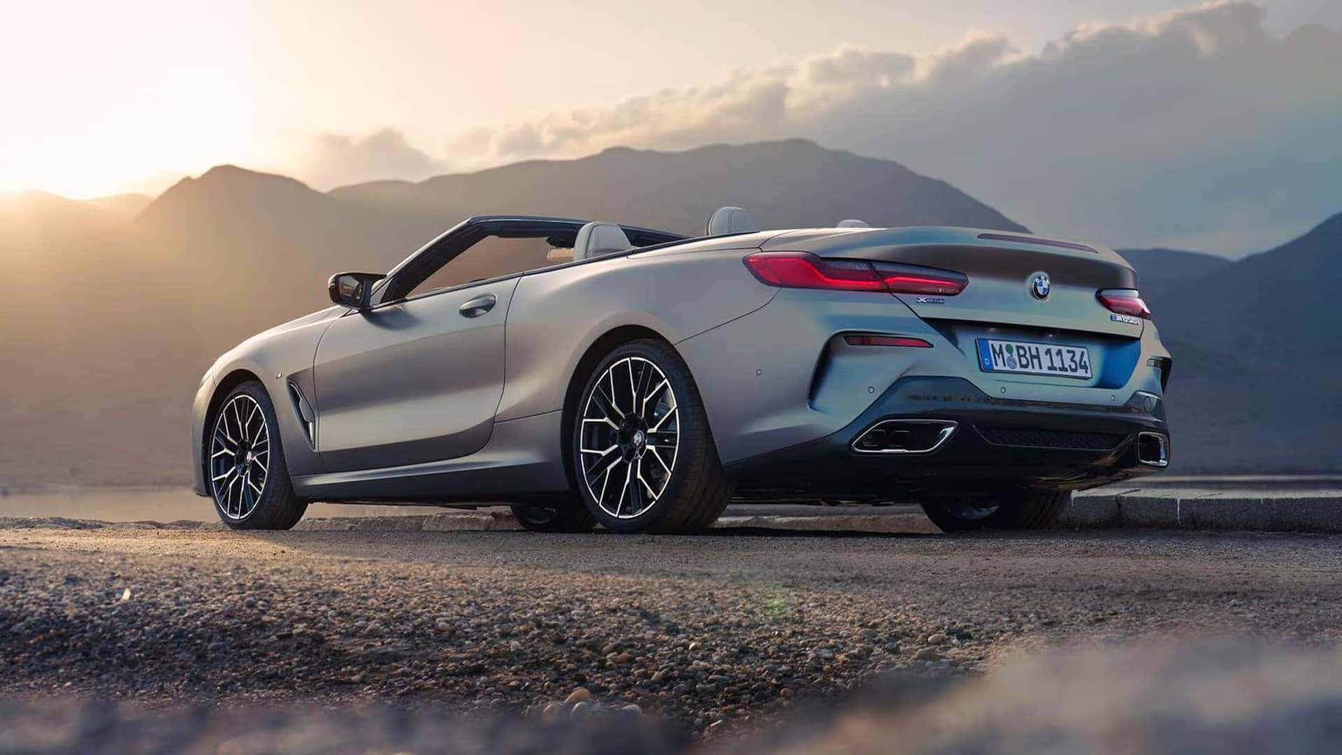 Back View of 2025 BMW 8 Series Convertible on Gravel Road