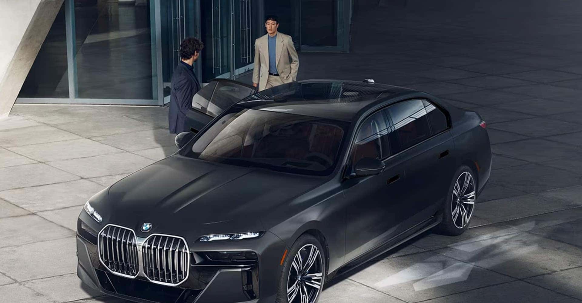 Two men by 2025 BMW 7 Series Sedan