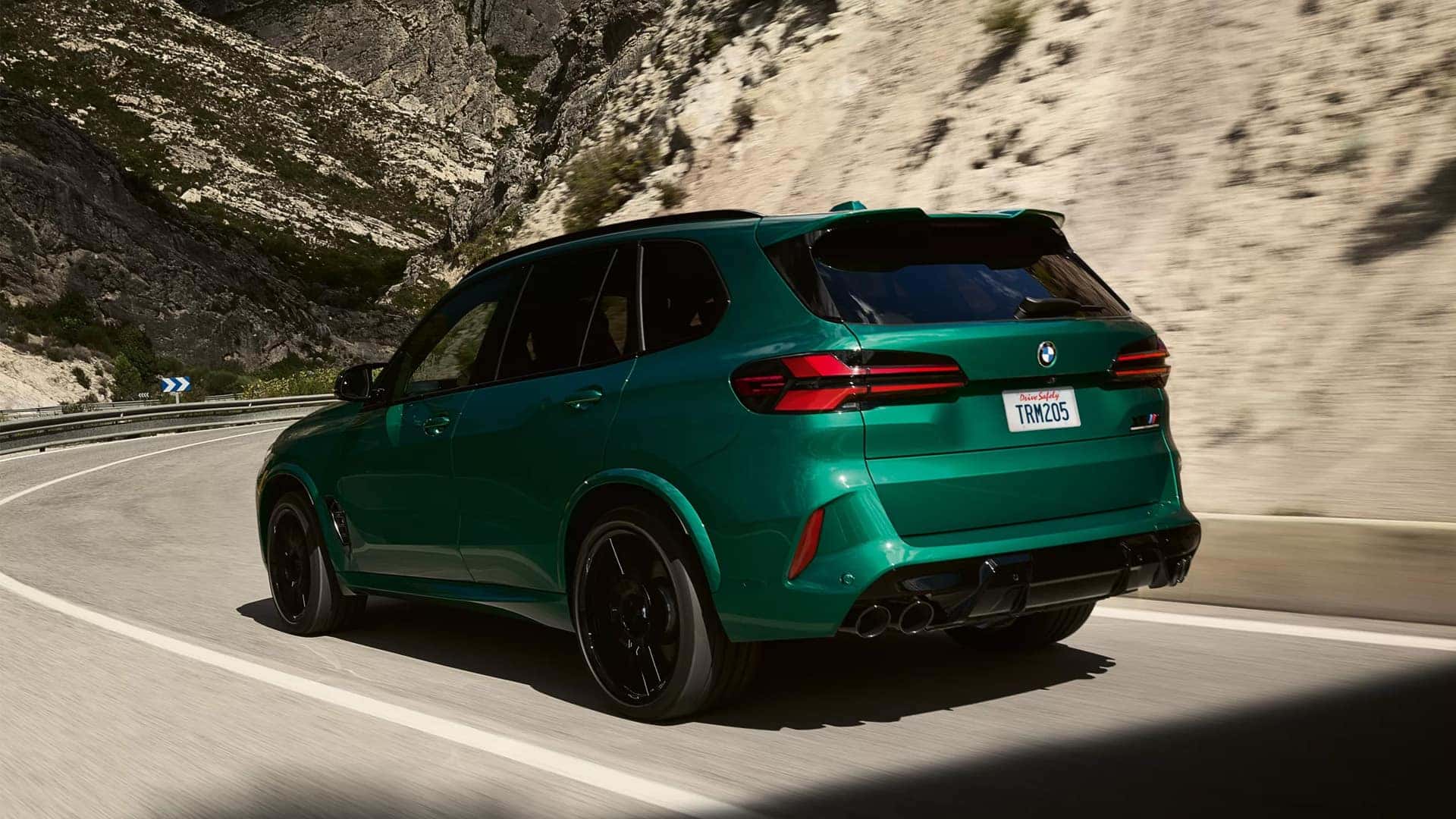 Back View of 2025 BMW X5 M Competition on Road