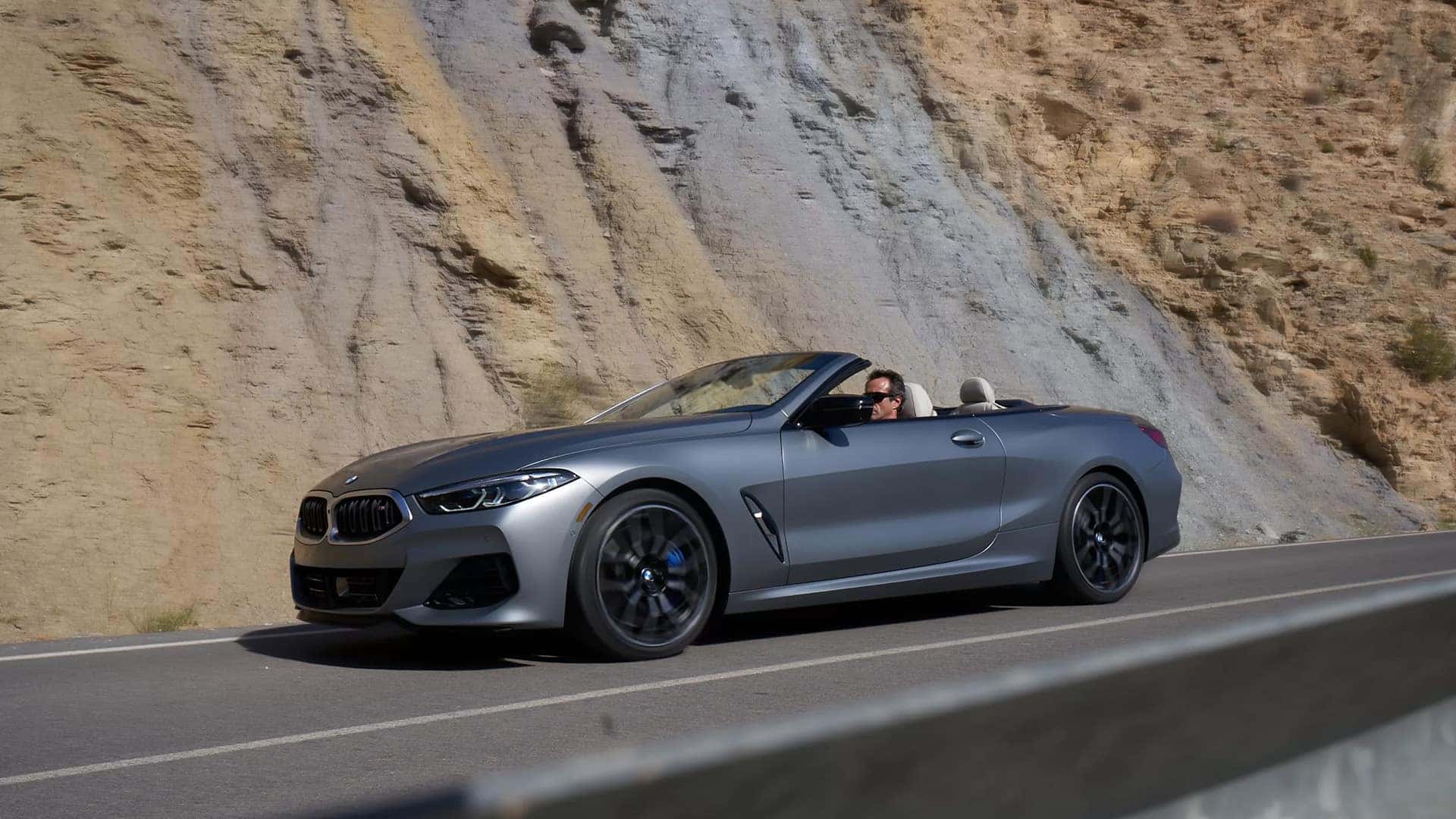 Gray BMW Z4 M40i Roadster Driving Down Road