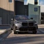 Dark-Gray-2026-BMW-X3-Making-a-Turn-on-a-Street