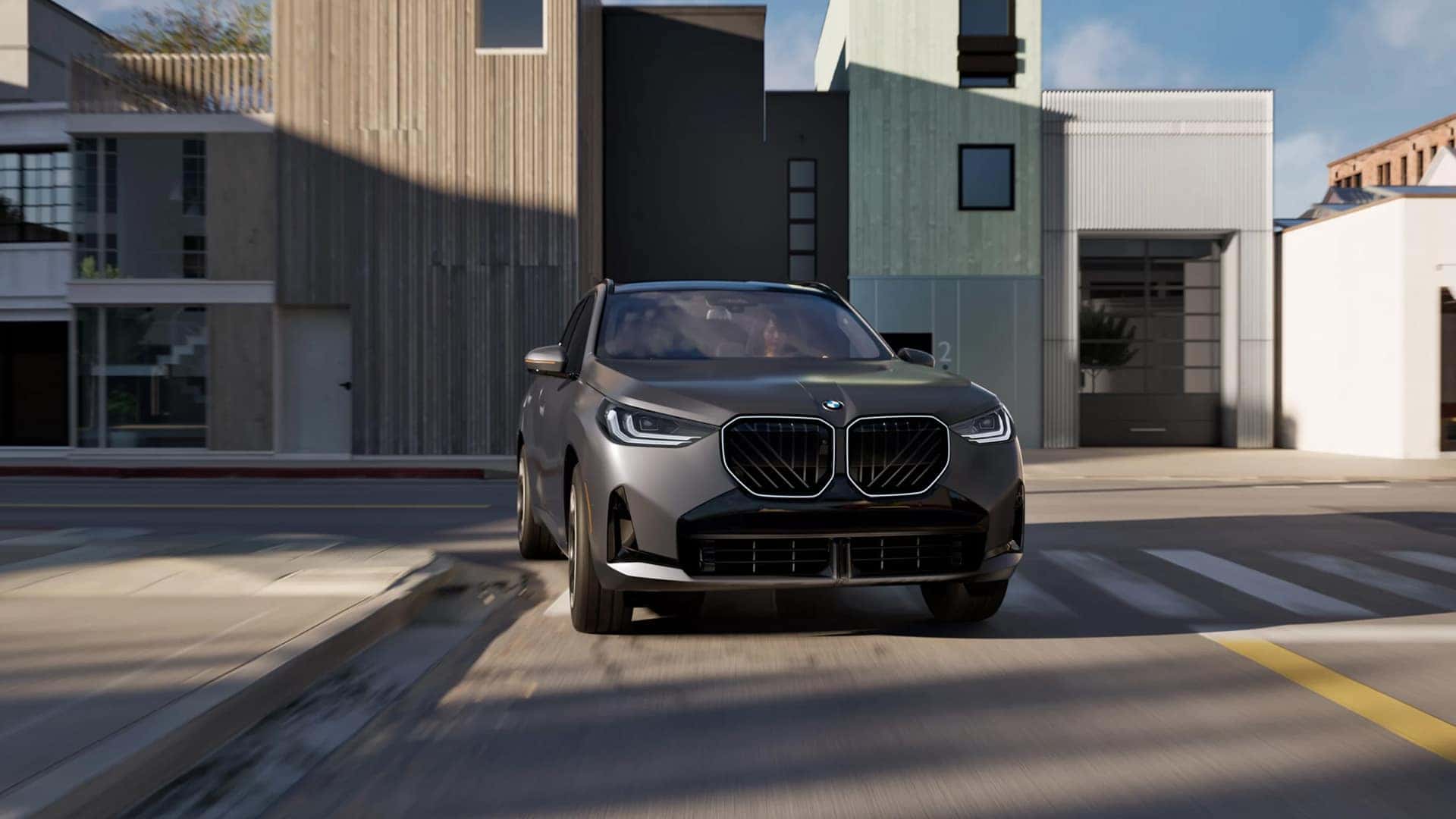 Dark-Gray-2026-BMW-X3-Making-a-Turn-on-a-Street