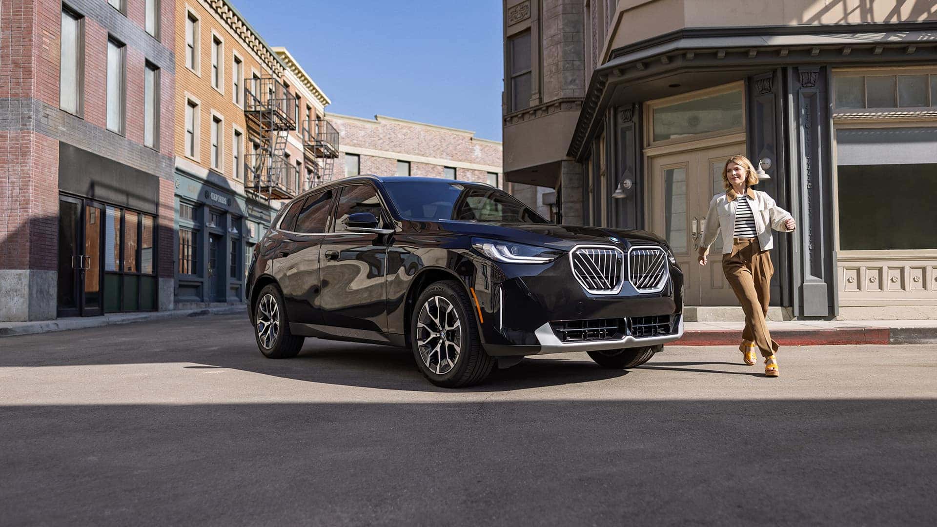 Woman-Walking-in-Front-of-2026-BMW-X3