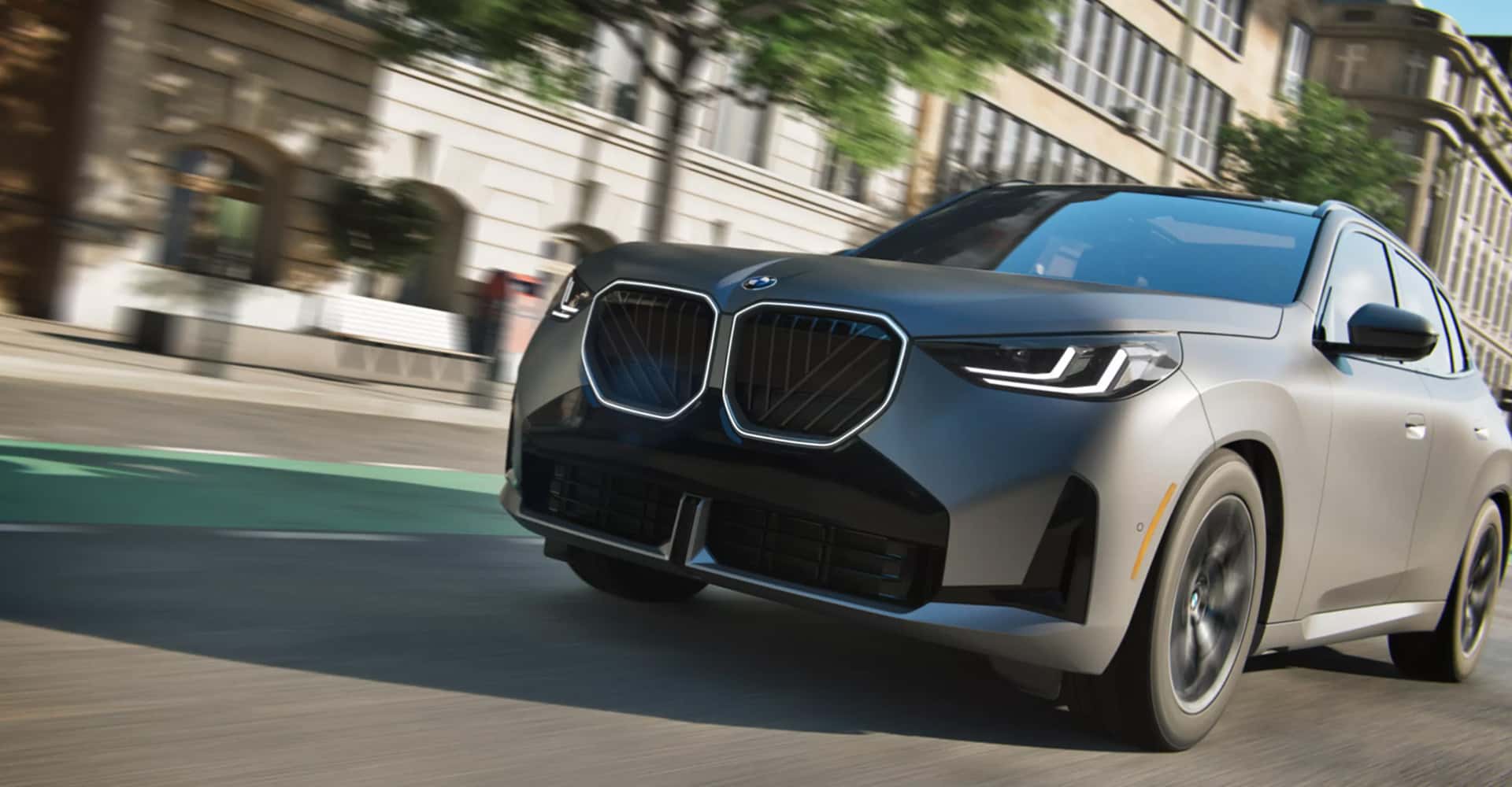 2026-BMW-X3-driving-down-city-road