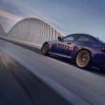 2026 BMW M2 CS driving on a bridge
