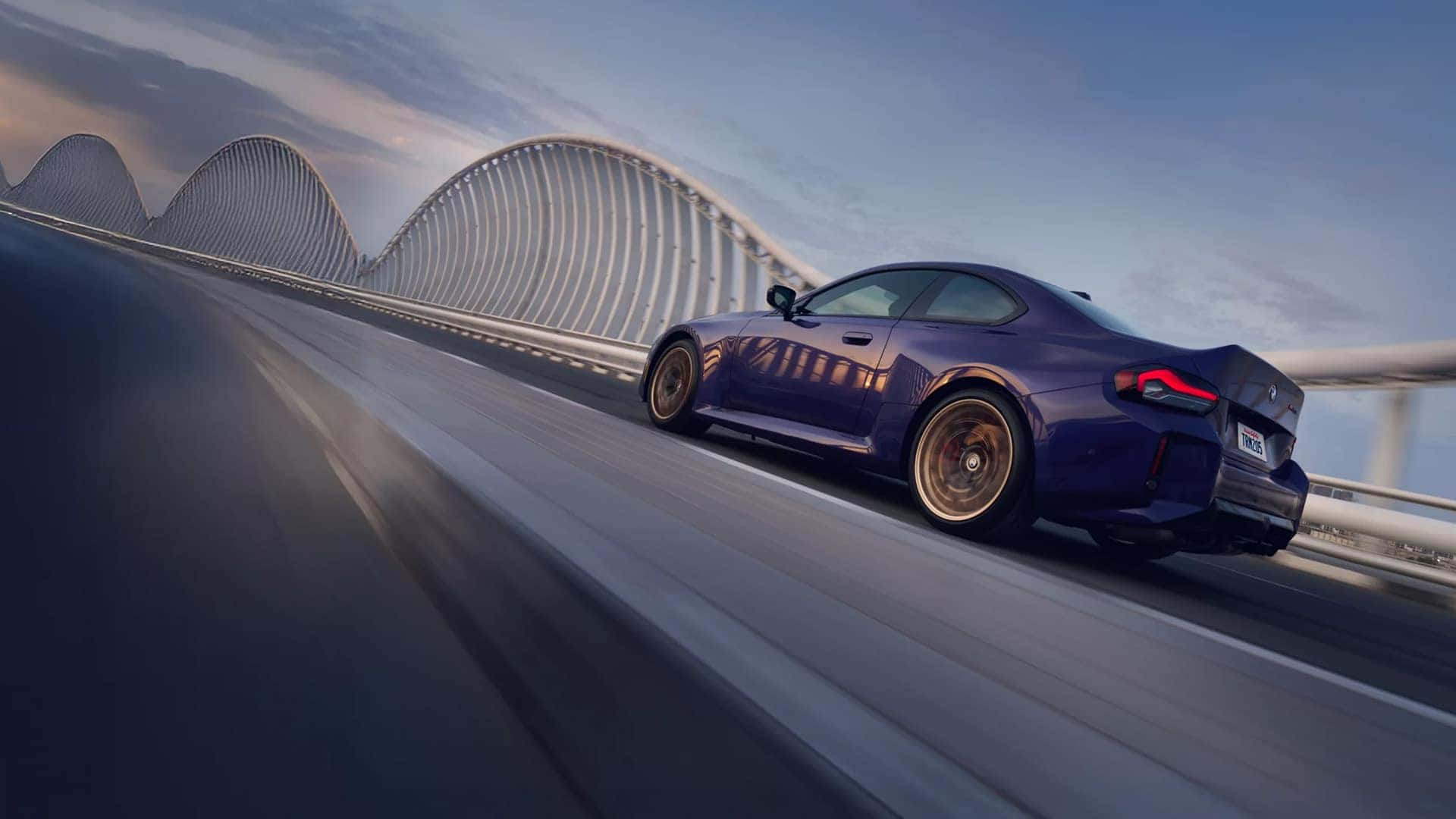 2026 BMW M2 CS driving on a bridge