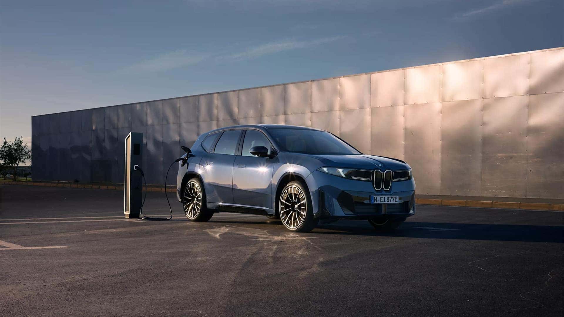 2026 BMW iX3 being charged in parking lot