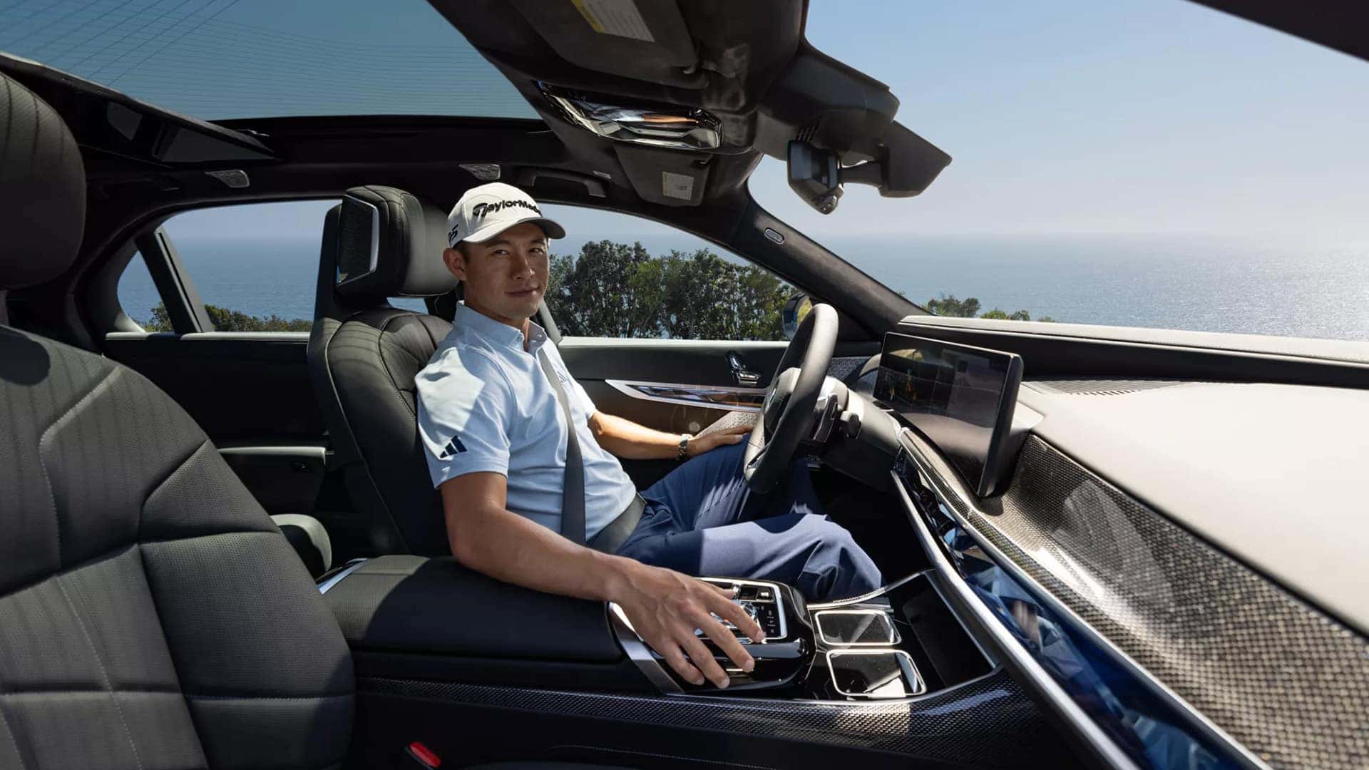 Man in driver's seat of BMW 7 Series sedan