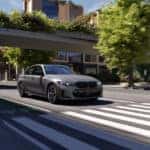 2026 BMW M3 driving down city street