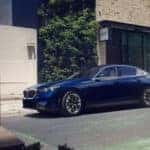 2026 BMW 5 Series driving down city street
