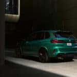 2026-BMW-X5M-green-rear-drivers-side