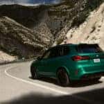 2026-BMW-X5M-green-rear-side-view