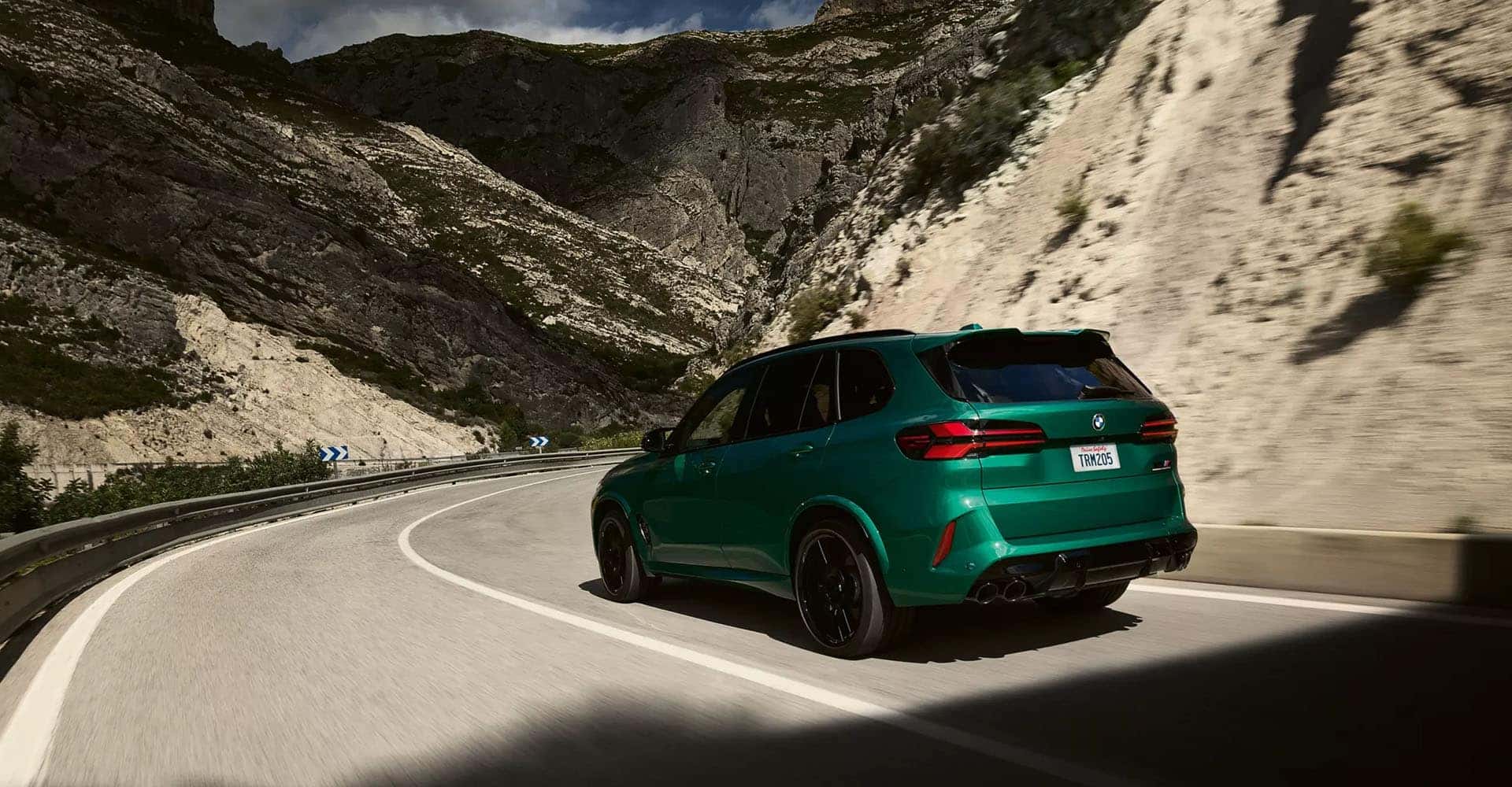 2026-BMW-X5M-green-rear-side-view