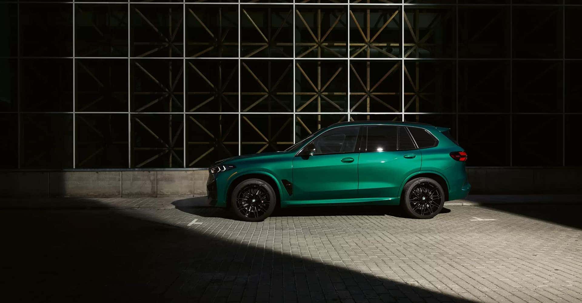2026-BMW-X5M-green-side-view