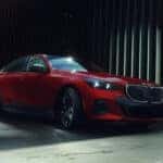 BMW Sedan pulling out of city garage onto street