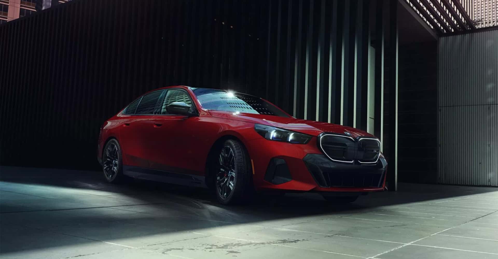 BMW Sedan pulling out of city garage onto street