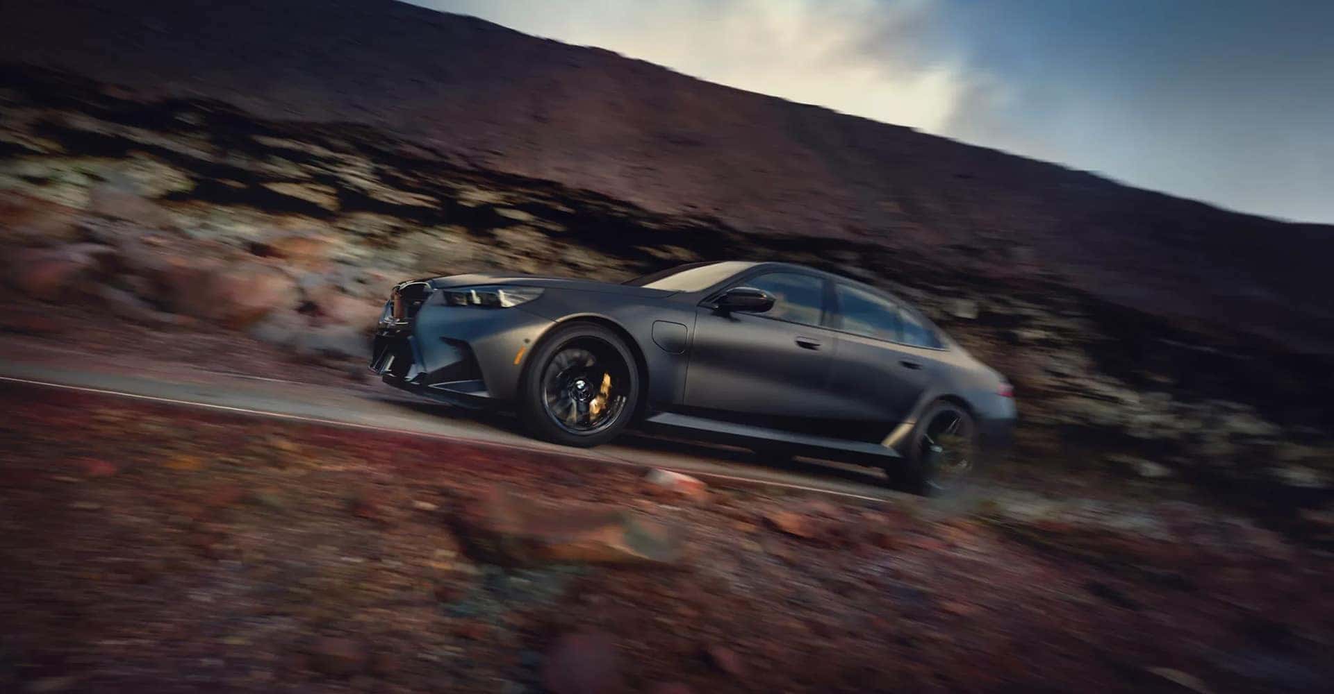 2027 BMW M5 driving in desert