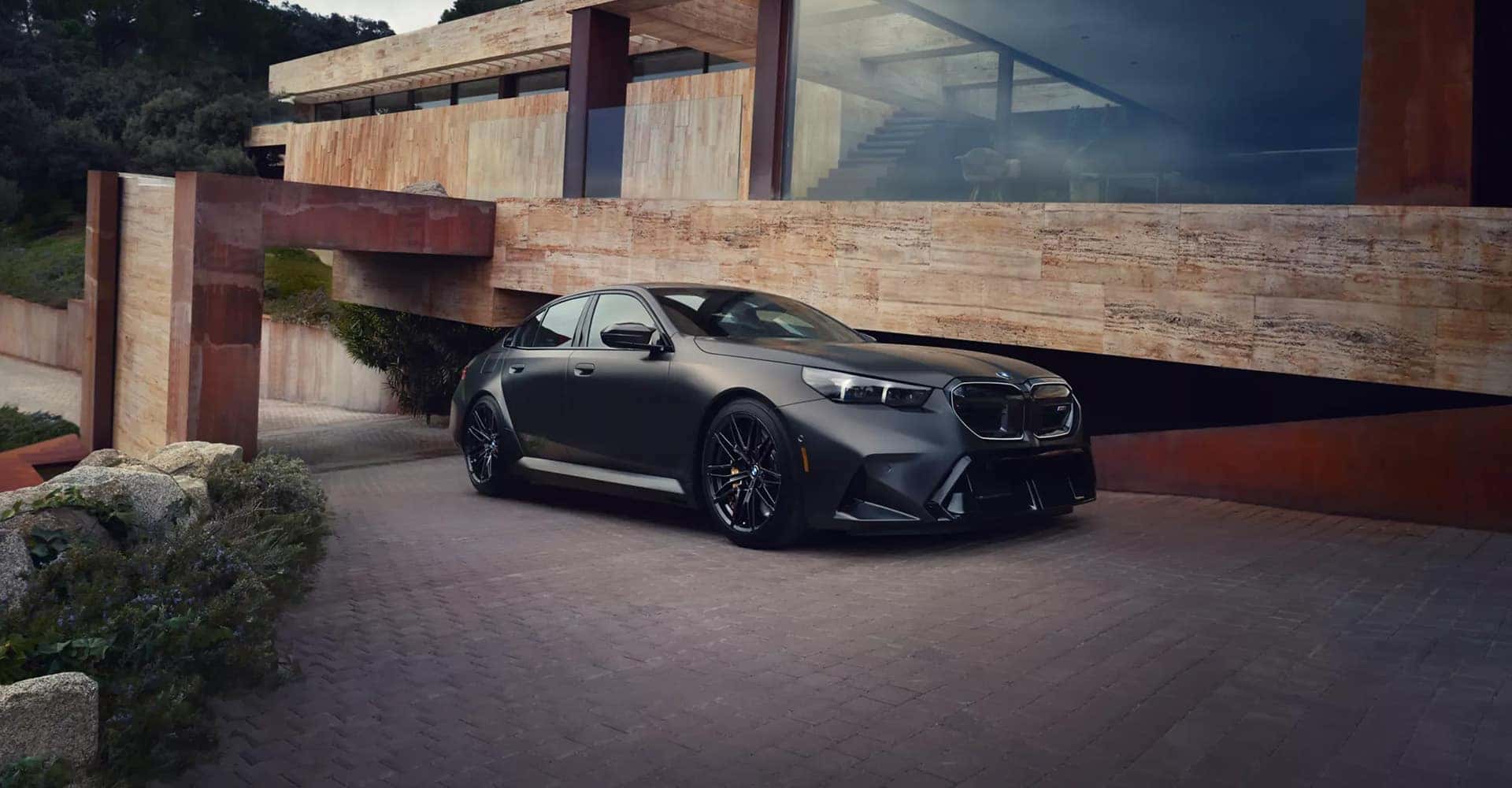 2027-BMW-M5-in-a-large-driveway