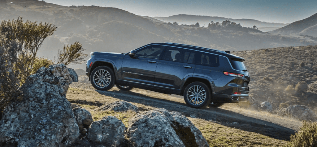 The 2021 Jeep Grand Cherokee L scaling up a steep hill.