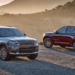 Two 2021 Jeep Grand Cherokee L models parked in the desert.