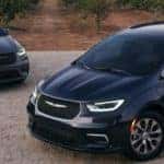 grey and black 2023 Chrysler Pacifica facing eachother