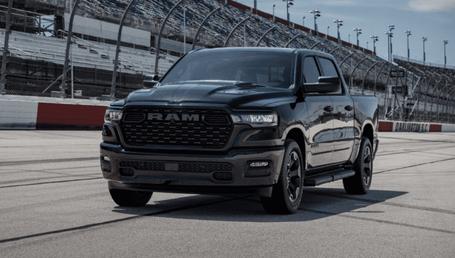 A black RAM 1500 on a racetrack.