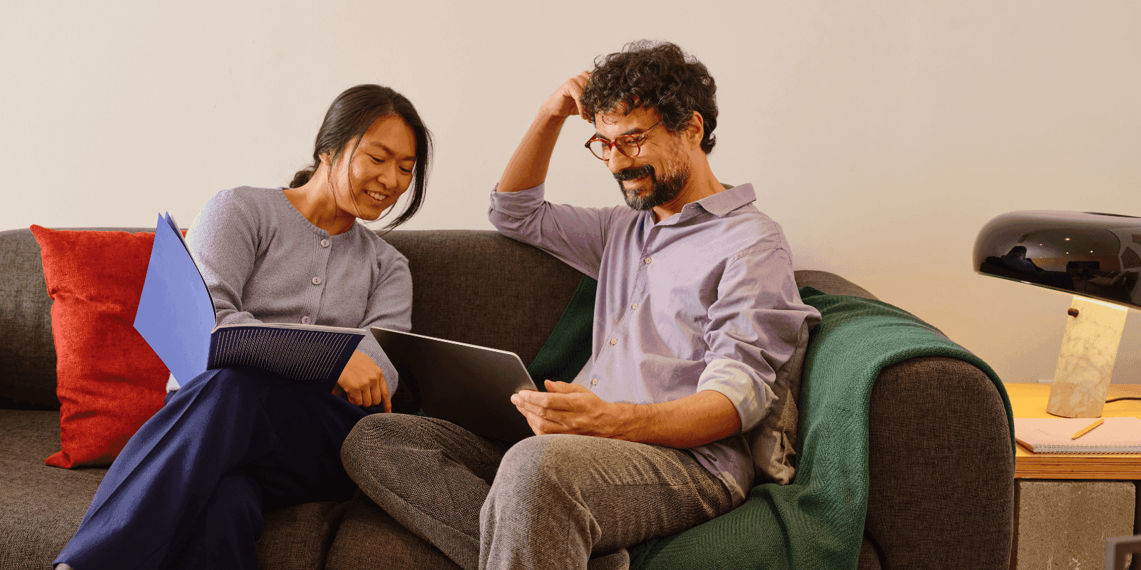 A couple looking at tablet discussing a car estimate