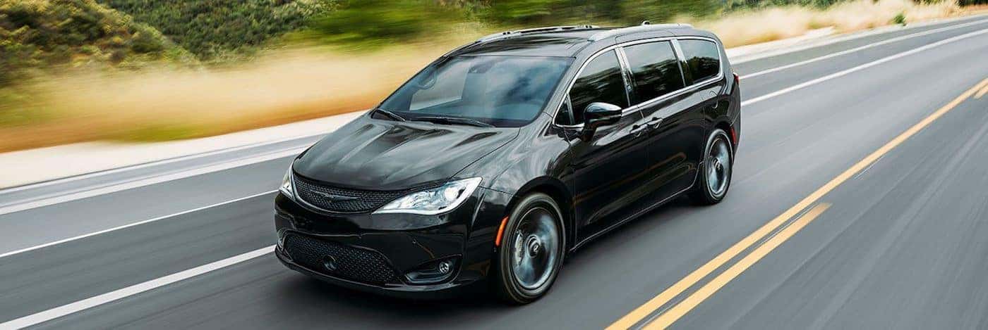A 2020 Chrysler Pacifica driving on a highway