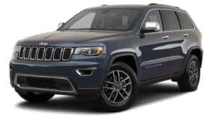 A dark blue 2020 Jeep Grand Cherokee is angled left.