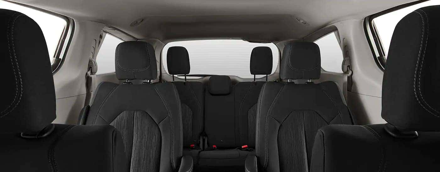 The black interior is shown from the front seats on a 2021 Chrysler Voyager.