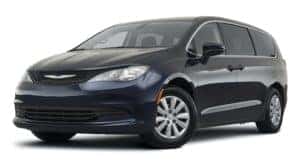 A dark blue 2021 Chrysler Voyager is angled left.