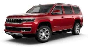 A red 2022 Wagoneer is angled left.