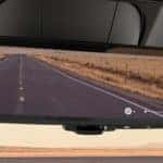 A close up shows a rear view mirror in a 2021 Ram 1500 after leaving a used car dealer in Lexington.