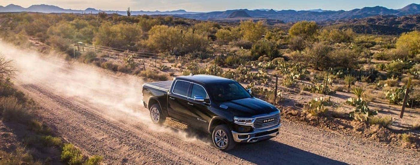 A black 2019 Ram 1500 is shown from the front at an angle.