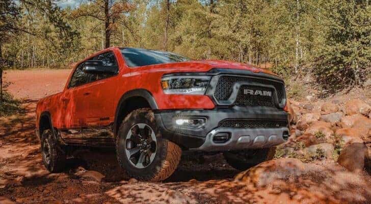 A red 2022 Ram 1500 Rebel is shown from the front at an angle after leaving a Richmond Ram dealer.