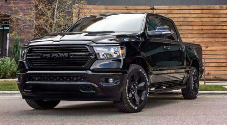 A black 2024 Ram 1500 DT is shown parked after viewing a Ram 1500 for sale near Bardstown.
