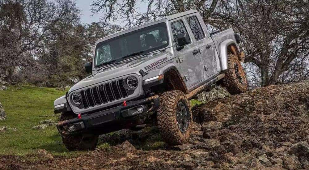 A grey 2024 Jeep Gladiator Rubicon is shown off-road after leaving a Jeep dealer near Louisville.