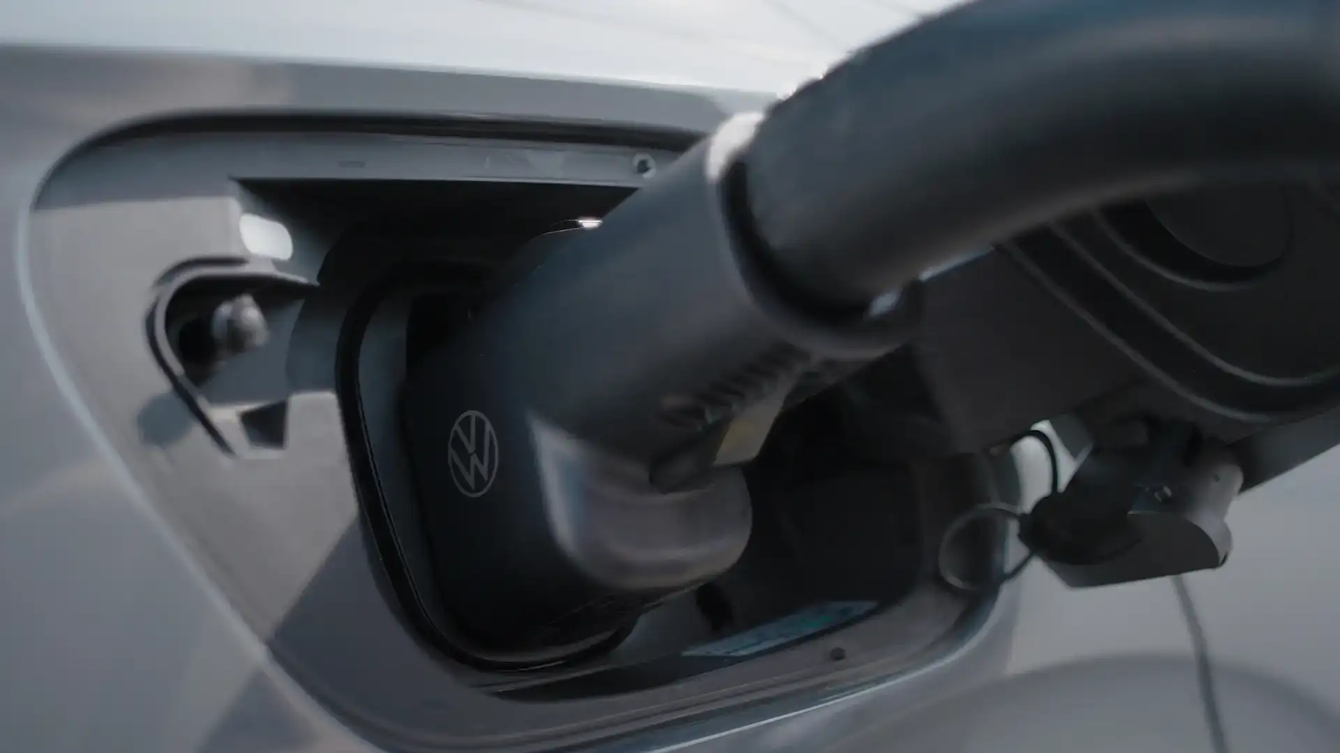 Volkswagen EV charging at a Tesla Supercharger