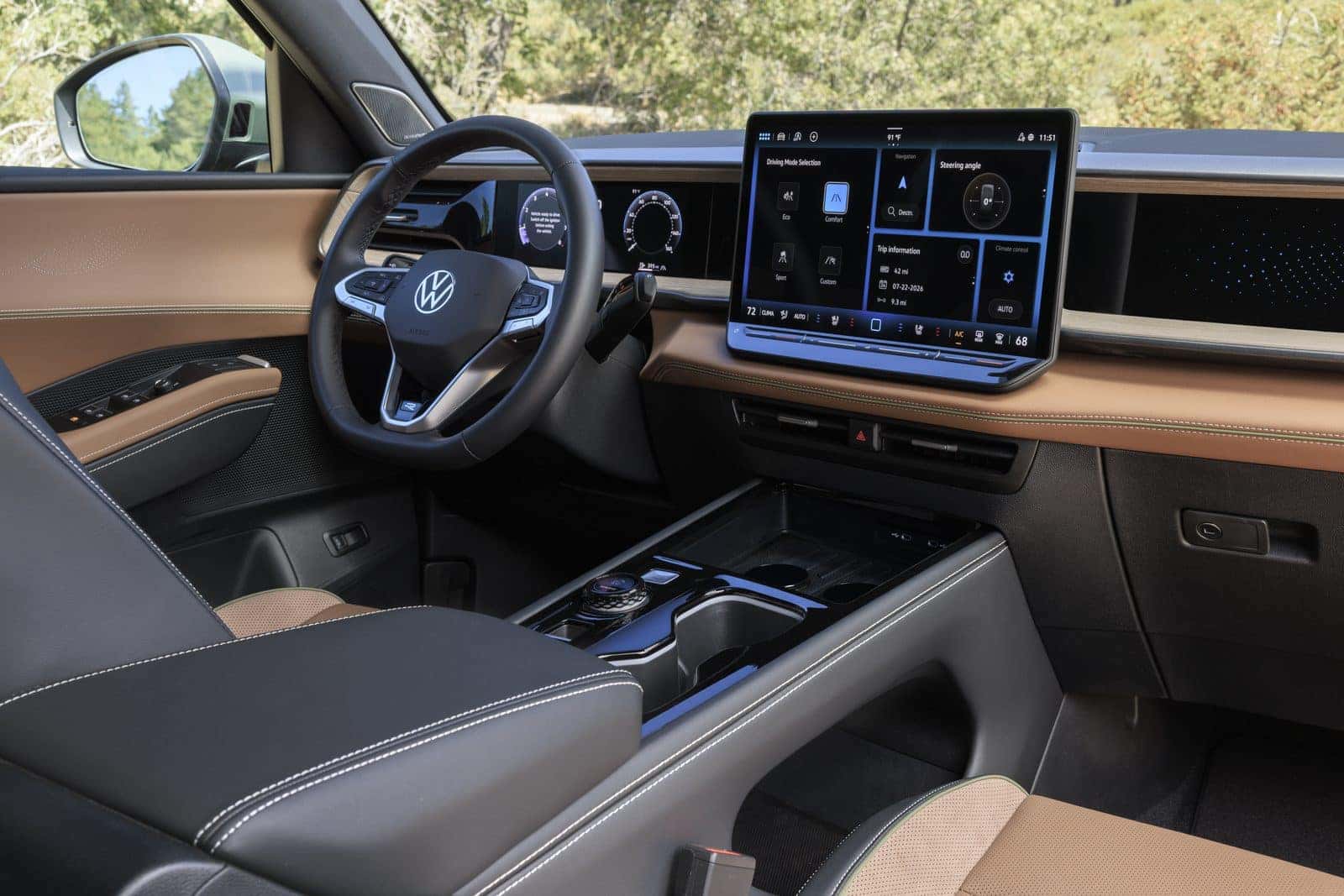 Interior of the 2027 Volkswagen Atlas Cross Sport showing the 15-inch touchscreen, 10.25-inch Digital Cockpit Pro, and Driver Experience Dial